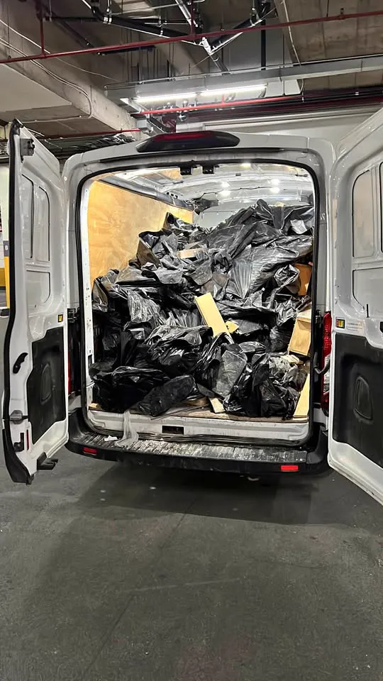 Van loaded with bagged demolition debris ready for haul-away