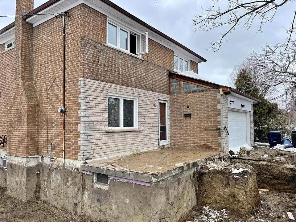 Brick home with a rear addition removed down to its foundation