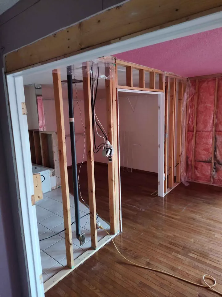 Framed opening cut between rooms with the surrounding floor and walls left intact